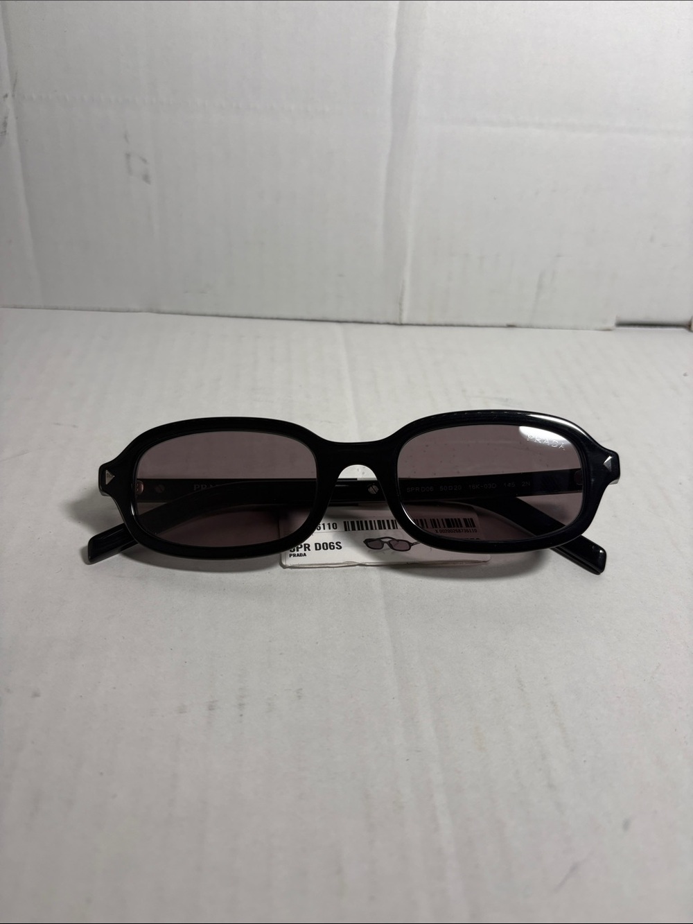 Prada 0PR Dogs Oval Frame Sunglasses in Black